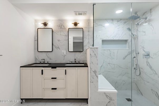 Bathroom, Dual Sink Vanities, Glass Shower, Interior, Marble, Marble Walls, Recessed Lighting