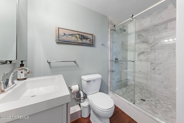 Bathroom, Glass Shower, Interior, Marble Walls, Wood Texture Flooring