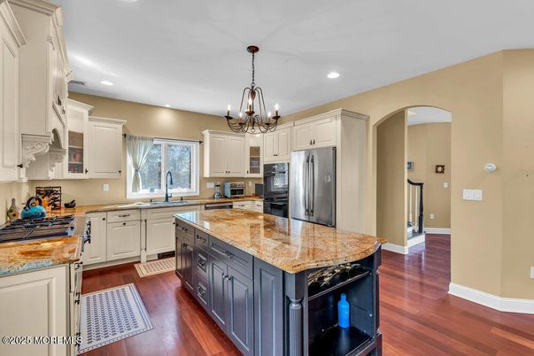 Chandelier, Interior, Kitchen, Recessed Lighting, Stainless Steel Appliances, Wood Texture Flooring