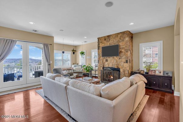 Fireplace, Interior, Living room, Pendant Lights, Recessed Lighting, Stone Walls, Wood Texture Flooring