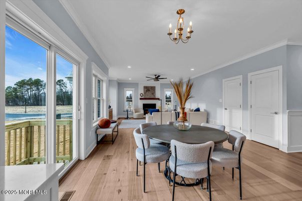 Chandelier, Dining room, Fireplace, Interior, Living room, Recessed Lighting, Wood Texture Flooring