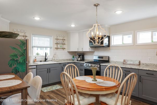 Dining room, Interior, Kitchen, Pendant Lights, Recessed Lighting, Stainless Steel Appliances, Wood Texture Flooring