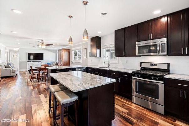 Dining room, Interior, Kitchen, Pendant Lights, Recessed Lighting, Stainless Steel Appliances, Wood Texture Flooring
