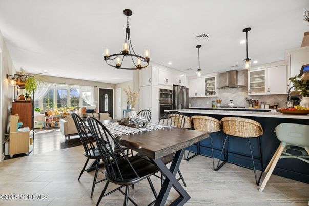 Chandelier, Dining room, Interior, Kitchen, Living room, Pendant Lights, Recessed Lighting, Stainless Steel Appliances