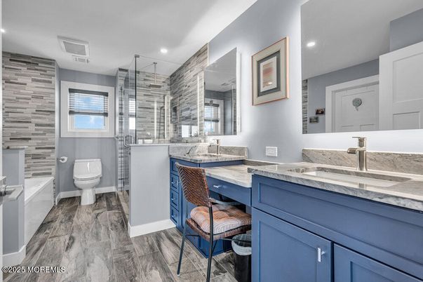 Bathroom, Dual Sink Vanities, Glass Shower, Interior, Recessed Lighting, Wood Texture Flooring