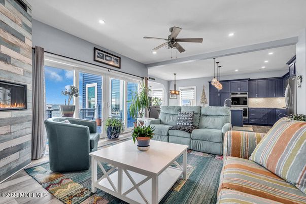 Fireplace, Interior, Kitchen, Living room, Pendant Lights, Recessed Lighting, Stainless Steel Appliances, Wood Texture Flooring