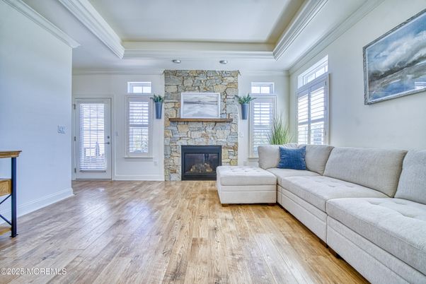 Fireplace, Interior, Living room, Recessed Lighting, Stone Walls, Wood Texture Flooring