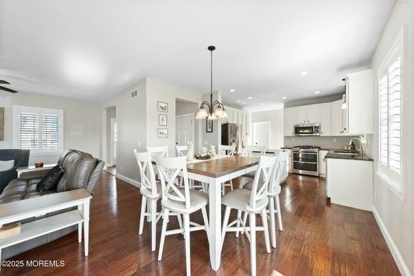 Dining room, Interior, Kitchen, Pendant Lights, Recessed Lighting, Stainless Steel Appliances, Wood Texture Flooring