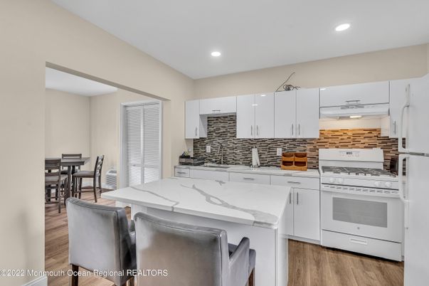 Dining room, Interior, Kitchen, Recessed Lighting, Stainless Steel Appliances, Wood Texture Flooring
