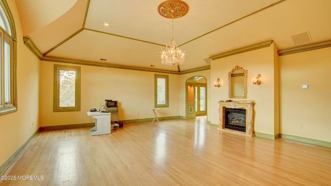 Chandelier, Empty room, Fireplace, Interior, Recessed Lighting, Wood Texture Flooring