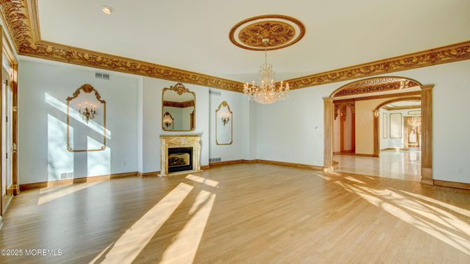 Chandelier, Empty room, Fireplace, Interior, Recessed Lighting, Wood Texture Flooring