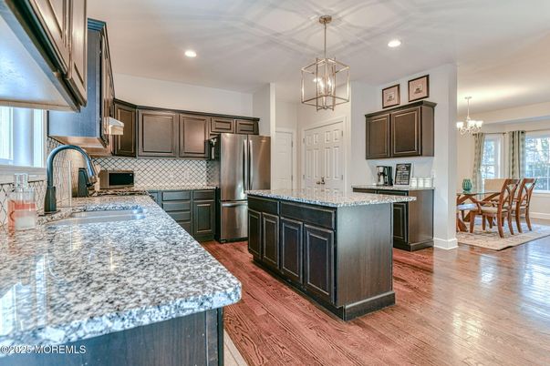 Chandelier, Dining room, Interior, Kitchen, Pendant Lights, Recessed Lighting, Stainless Steel Appliances, Wood Texture Flooring
