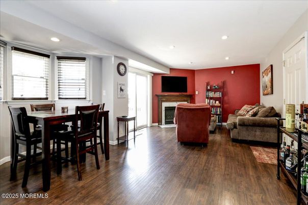 Dining room, Fireplace, Interior, Living room, Recessed Lighting, Wood Texture Flooring