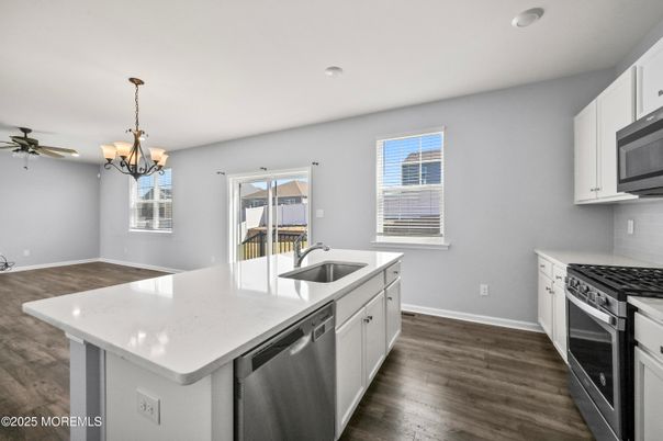 Chandelier, Interior, Kitchen, Recessed Lighting, Stainless Steel Appliances, Wood Texture Flooring