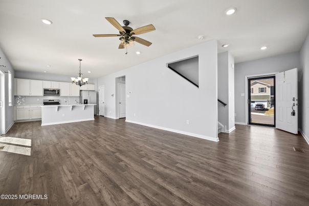 Chandelier, Empty room, Interior, Kitchen, Recessed Lighting, Stainless Steel Appliances, Wood Texture Flooring
