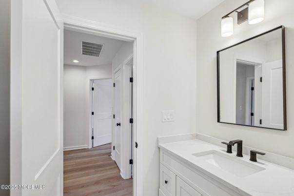 Bathroom, Dual Sink Vanities, Interior, Recessed Lighting, Wood Texture Flooring