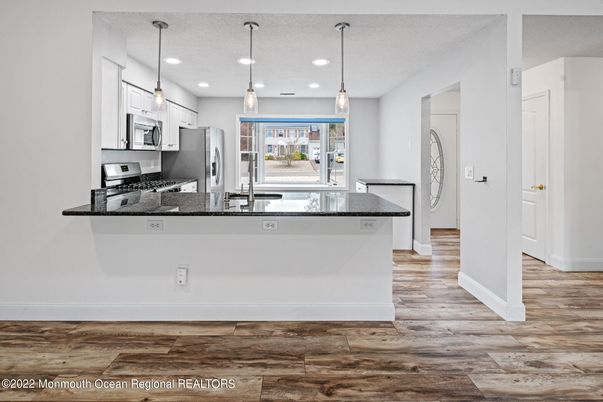 Interior, Kitchen, Pendant Lights, Recessed Lighting, Stainless Steel Appliances, Wood Texture Flooring