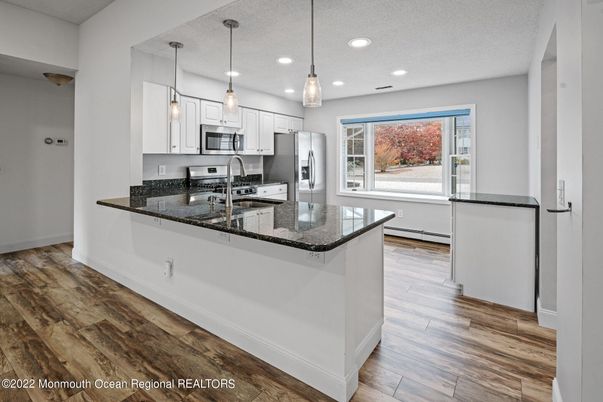Interior, Kitchen, Pendant Lights, Recessed Lighting, Stainless Steel Appliances, Wood Texture Flooring