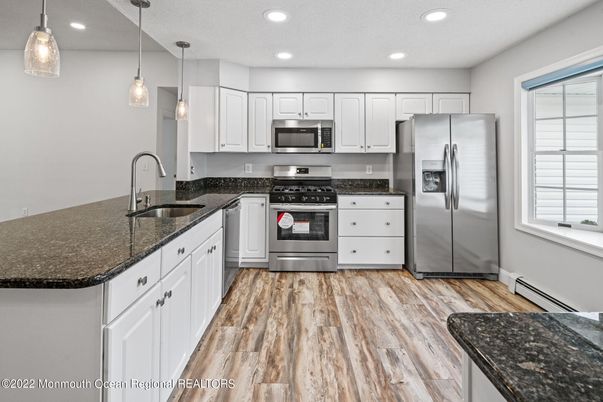 Interior, Kitchen, Pendant Lights, Recessed Lighting, Stainless Steel Appliances, Wood Texture Flooring