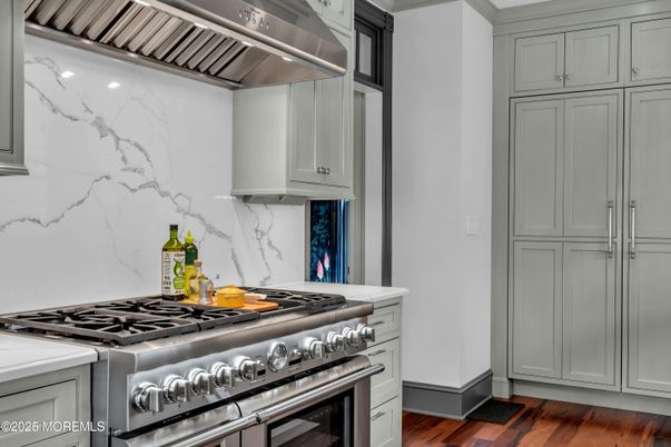 Interior, Kitchen, Marble Walls, Stainless Steel Appliances, Wood Texture Flooring