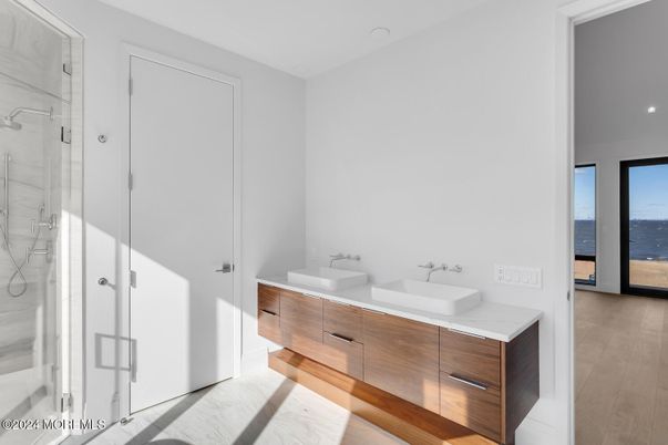 Bathroom, Dual Sink Vanities, Glass Shower, Interior, Recessed Lighting, Wood Texture Flooring