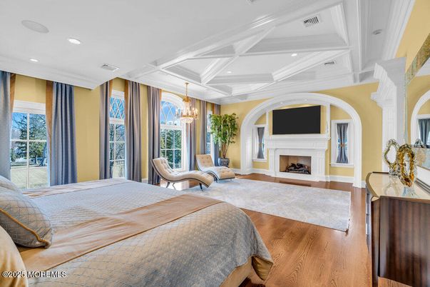 Bedroom, Chandelier, Fireplace, Interior, Recessed Lighting, Wood Texture Flooring
