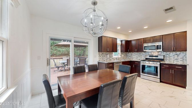 Chandelier, Dining room, Interior, Kitchen, Marble, Pendant Lights, Recessed Lighting, Stainless Steel Appliances