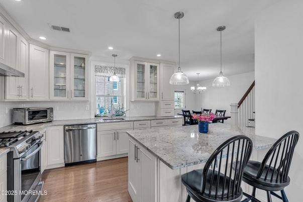 Dining room, Interior, Kitchen, Pendant Lights, Recessed Lighting, Stainless Steel Appliances, Wood Texture Flooring