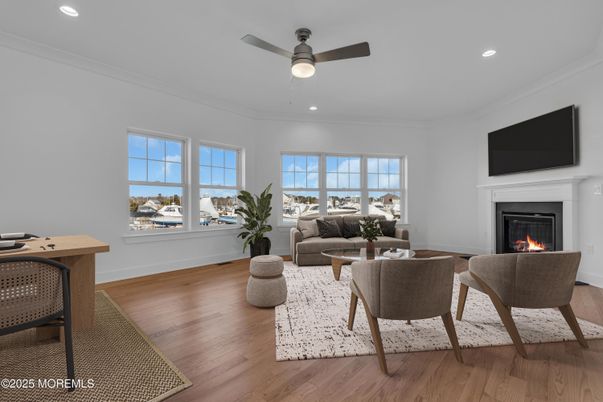 Fireplace, Interior, Living room, Recessed Lighting, Water, Wood Texture Flooring