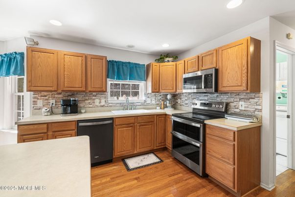Interior, Kitchen, Recessed Lighting, Stainless Steel Appliances, Wood Texture Flooring
