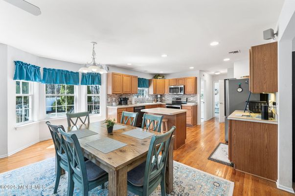 Dining room, Interior, Kitchen, Pendant Lights, Recessed Lighting, Stainless Steel Appliances, Wood Texture Flooring