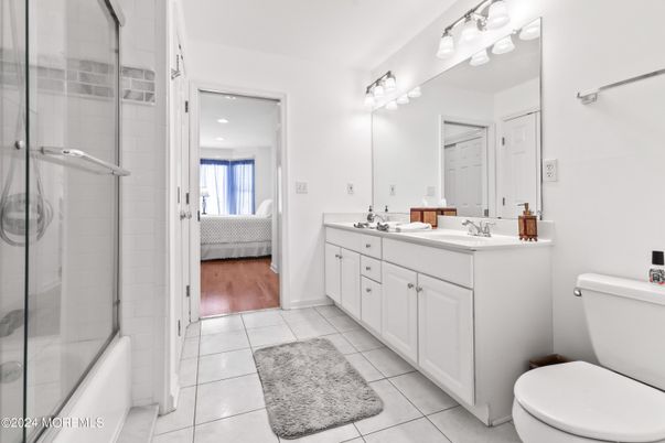 Bathroom, Bedroom, Dual Sink Vanities, Glass Shower, Interior, Recessed Lighting, Wood Texture Flooring