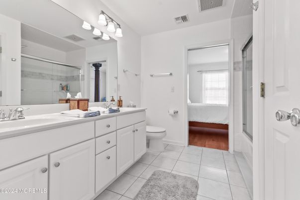 Bathroom, Dual Sink Vanities, Glass Shower, Interior, Wood Texture Flooring