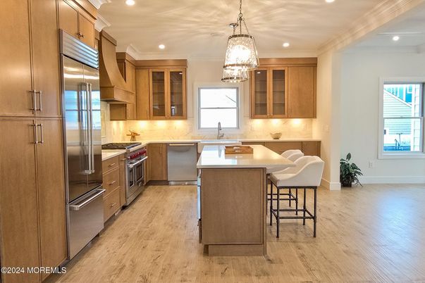 Chandelier, Interior, Kitchen, Pendant Lights, Recessed Lighting, Stainless Steel Appliances, Wood Texture Flooring