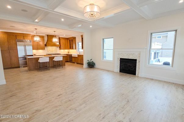 Fireplace, Interior, Kitchen, Pendant Lights, Recessed Lighting, Stainless Steel Appliances, Wood Texture Flooring