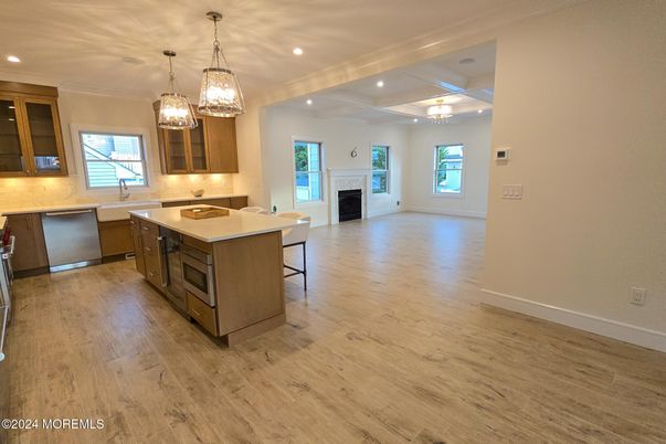 Chandelier, Fireplace, Interior, Kitchen, Pendant Lights, Recessed Lighting, Wood Texture Flooring