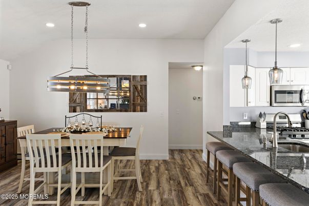 Dining room, Interior, Kitchen, Pendant Lights, Recessed Lighting, Stainless Steel Appliances, Wood Texture Flooring