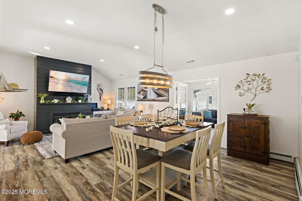 Dining room, Fireplace, Interior, Living room, Pendant Lights, Recessed Lighting, Wood Texture Flooring