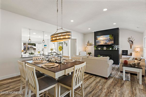 Dining room, Fireplace, Interior, Living room, Pendant Lights, Recessed Lighting, Wood Texture Flooring