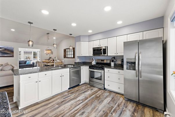Dining room, Interior, Kitchen, Pendant Lights, Recessed Lighting, Stainless Steel Appliances, Wood Texture Flooring