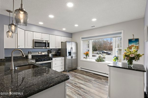 Interior, Kitchen, Pendant Lights, Recessed Lighting, Stainless Steel Appliances, Wood Texture Flooring
