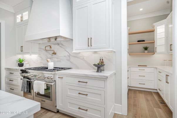 Interior, Kitchen, Marble Walls, Recessed Lighting, Stainless Steel Appliances, Wood Texture Flooring