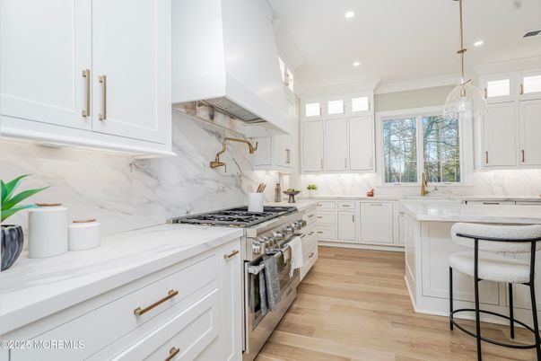 Interior, Kitchen, Marble Walls, Pendant Lights, Recessed Lighting, Stainless Steel Appliances, Wood Texture Flooring