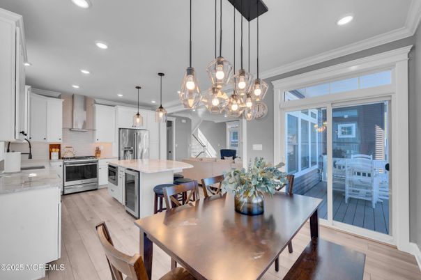 Dining room, Interior, Kitchen, Pendant Lights, Recessed Lighting, Stainless Steel Appliances, Wood Texture Flooring
