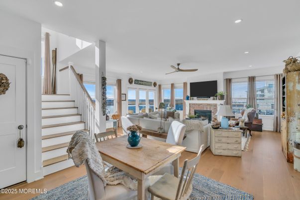 Dining room, Fireplace, Interior, Living room, Recessed Lighting, Wood Texture Flooring