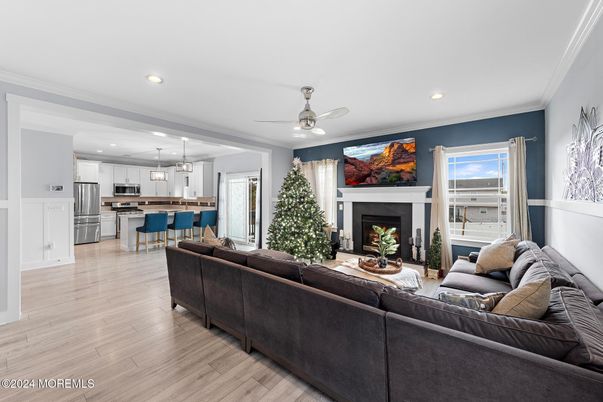 Fireplace, Interior, Kitchen, Living room, Pendant Lights, Recessed Lighting, Stainless Steel Appliances, Wood Texture Flooring