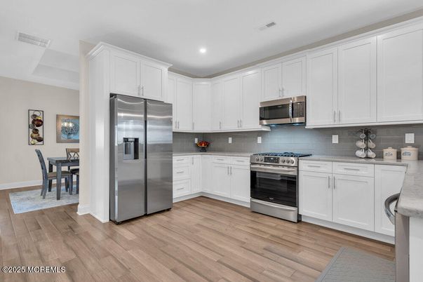 Dining room, Interior, Kitchen, Recessed Lighting, Stainless Steel Appliances, Wood Texture Flooring
