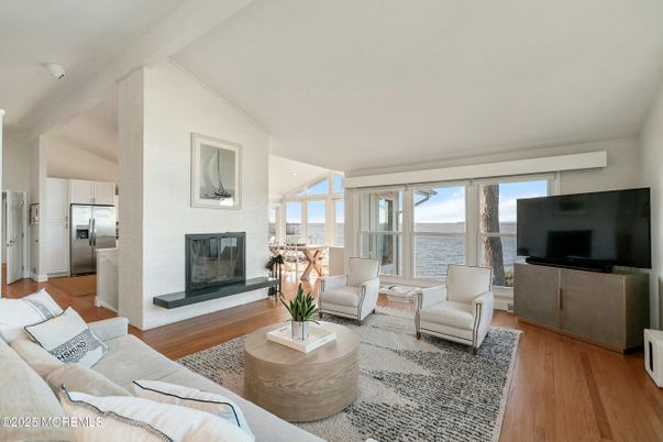 Fireplace, Interior, Kitchen, Living room, Stainless Steel Appliances, Water, Wood Texture Flooring