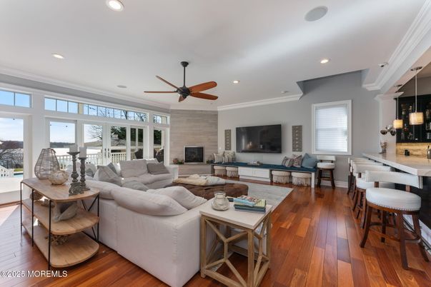 Dining room, Fireplace, Interior, Living room, Recessed Lighting, Wood Texture Flooring