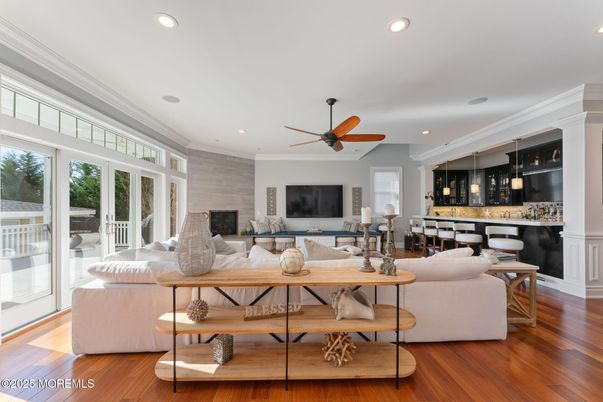 Dining room, Fireplace, Interior, Living room, Recessed Lighting, Wood Texture Flooring